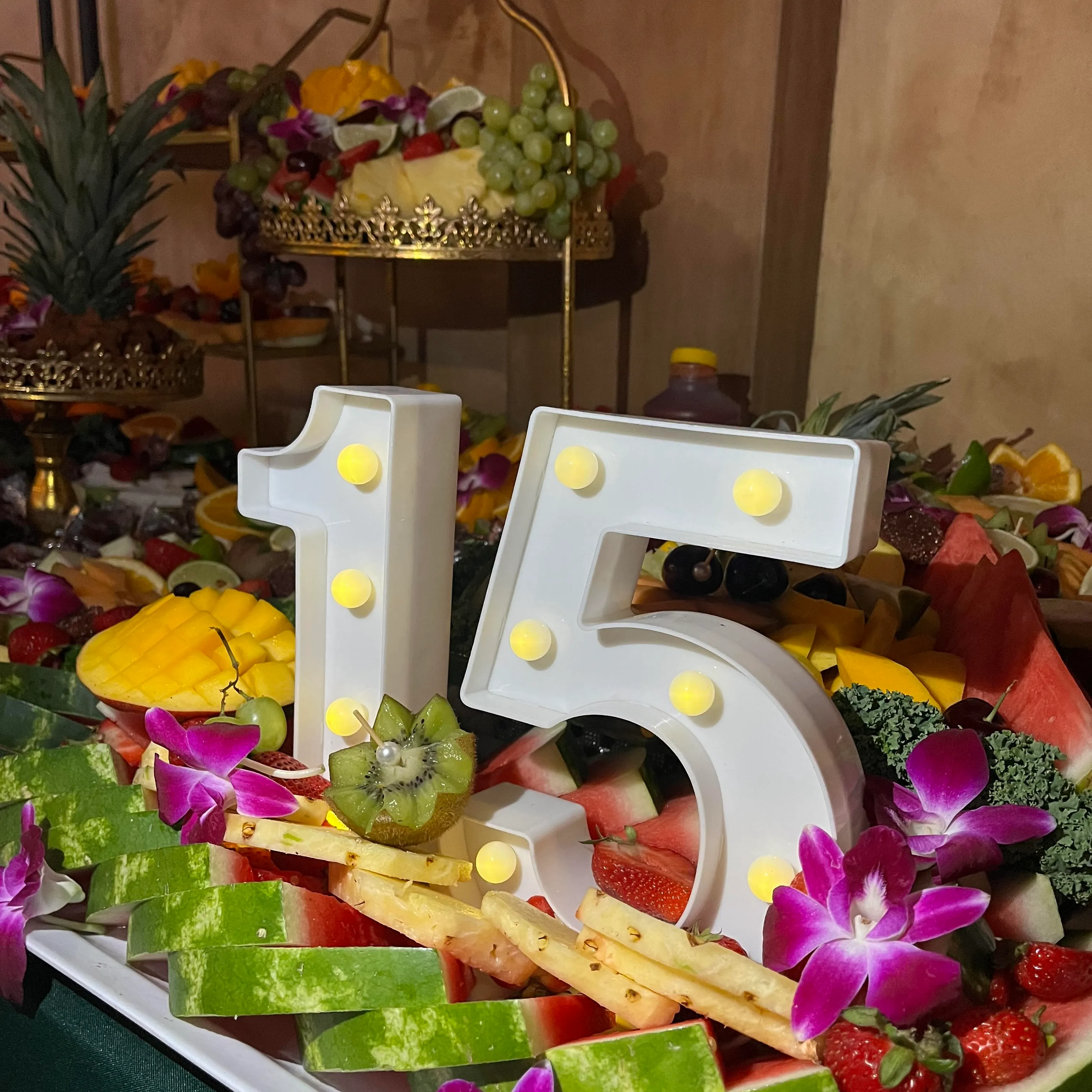 Fresh fruit table for quinceanera party.